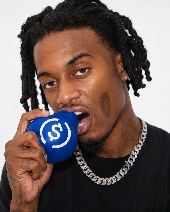 Playboi Carti biting the USDC pear