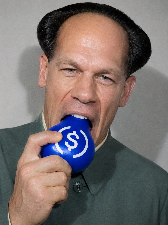 John Xina biting the USDC pear